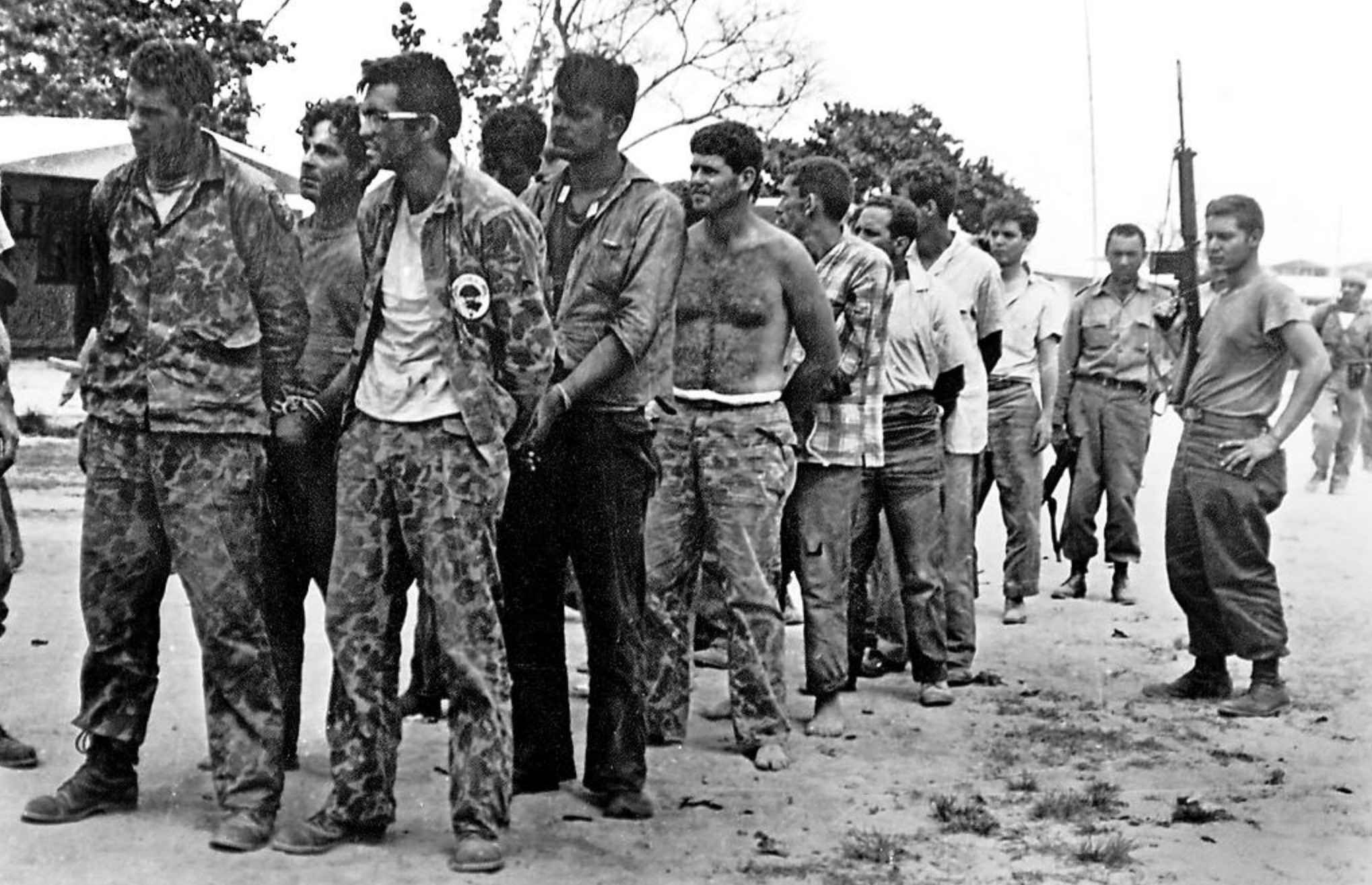 Invaders during the Bay of Pigs surrender to Cuban soldiers. 
